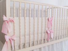 White linen crib bumper with pink  ties