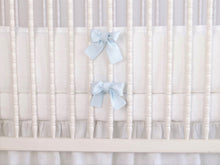 White linen crib bumper with pink  ties