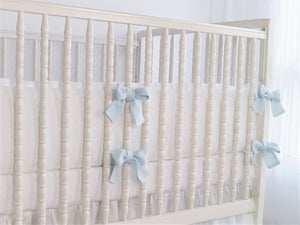 White linen crib bumper with pink  ties