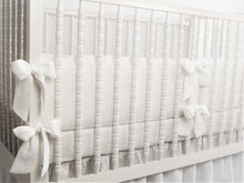 White linen crib bumper with short ties